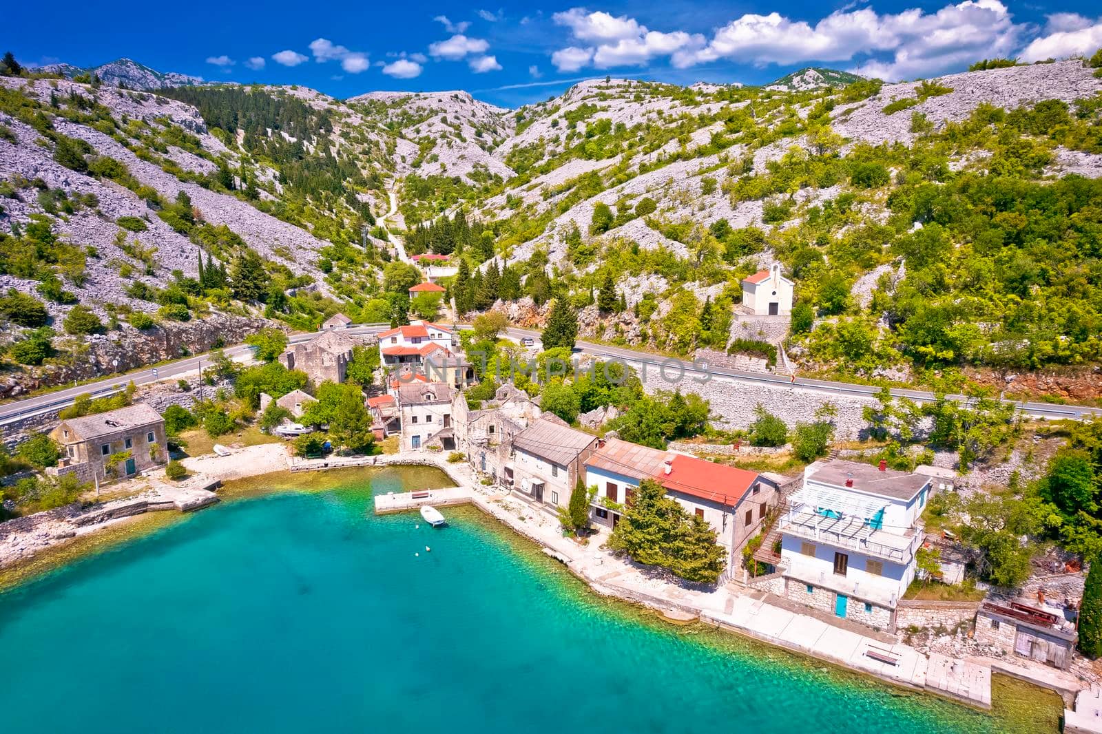 Scenic fishermen village Tribanj Lisarica under Velebit mountain aerial view, archipelago of Adriatic sea in Croatia