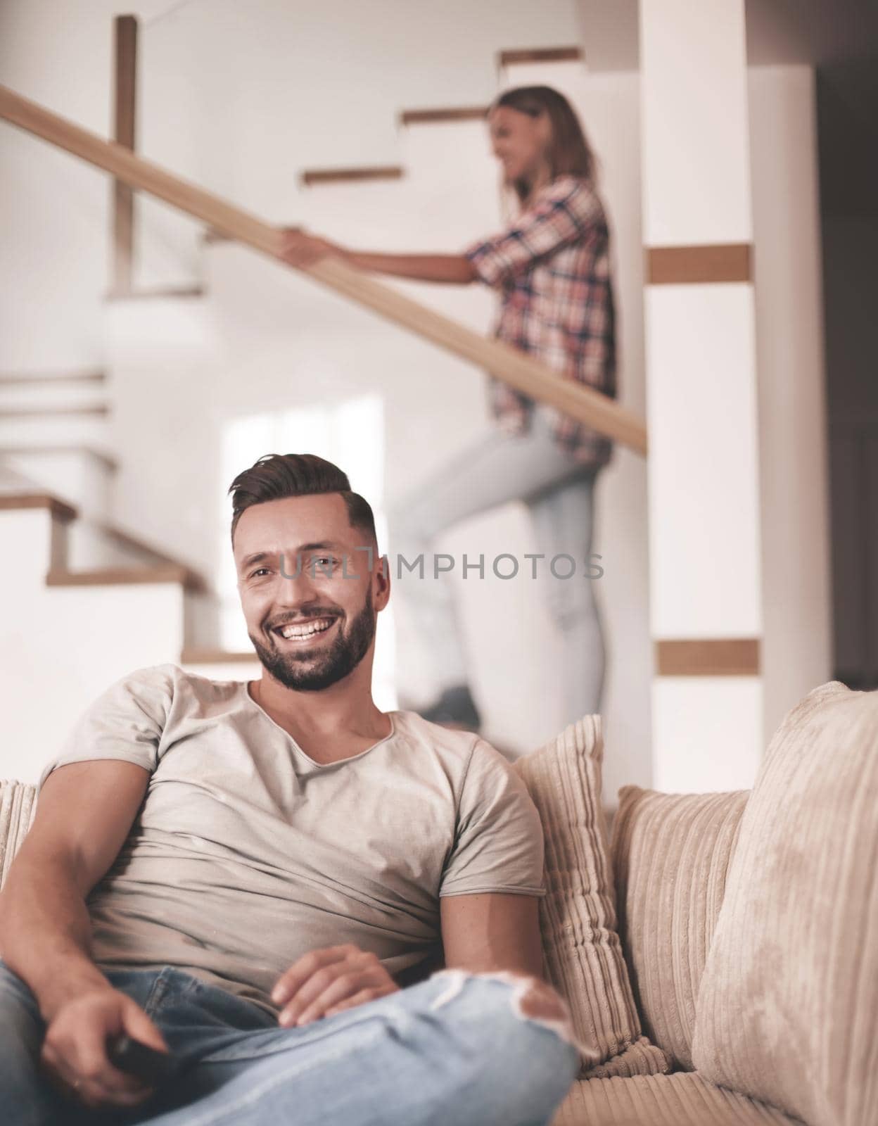 close up. young man sitting on sofa. photo with copy space
