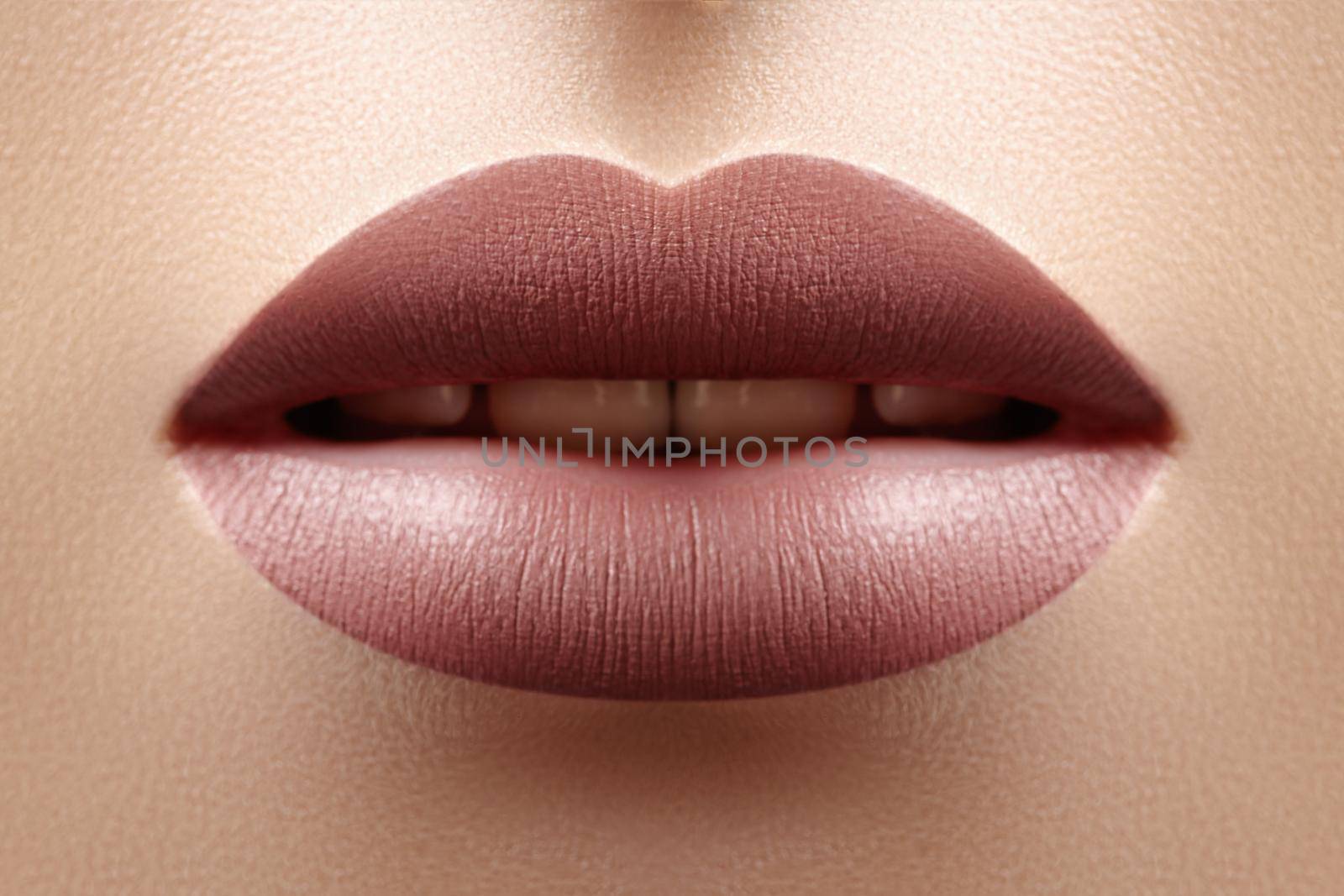 Close-up Female Full Lips with Fashion Natural Lipstick Makeup. Macro Sexy Lip Stick Make-up. Mat Fashionable Style by MarinaFrost