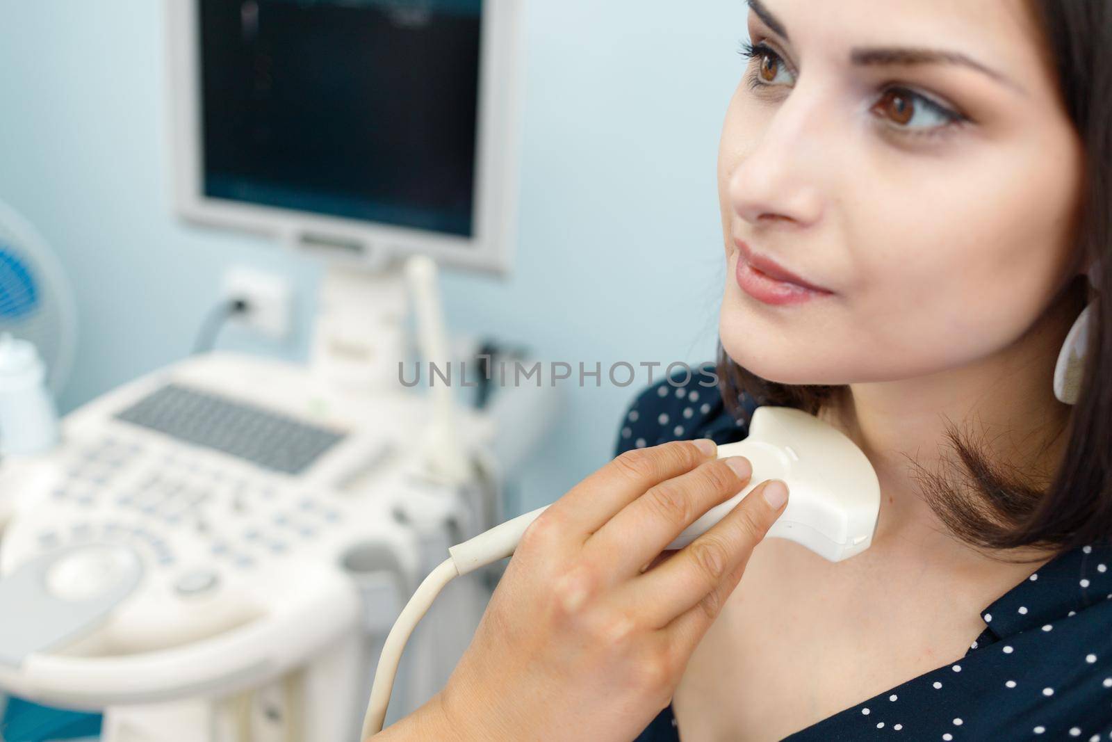 Close-up of ultrasound examination of the patient's neck region in the diagnostic clinic.