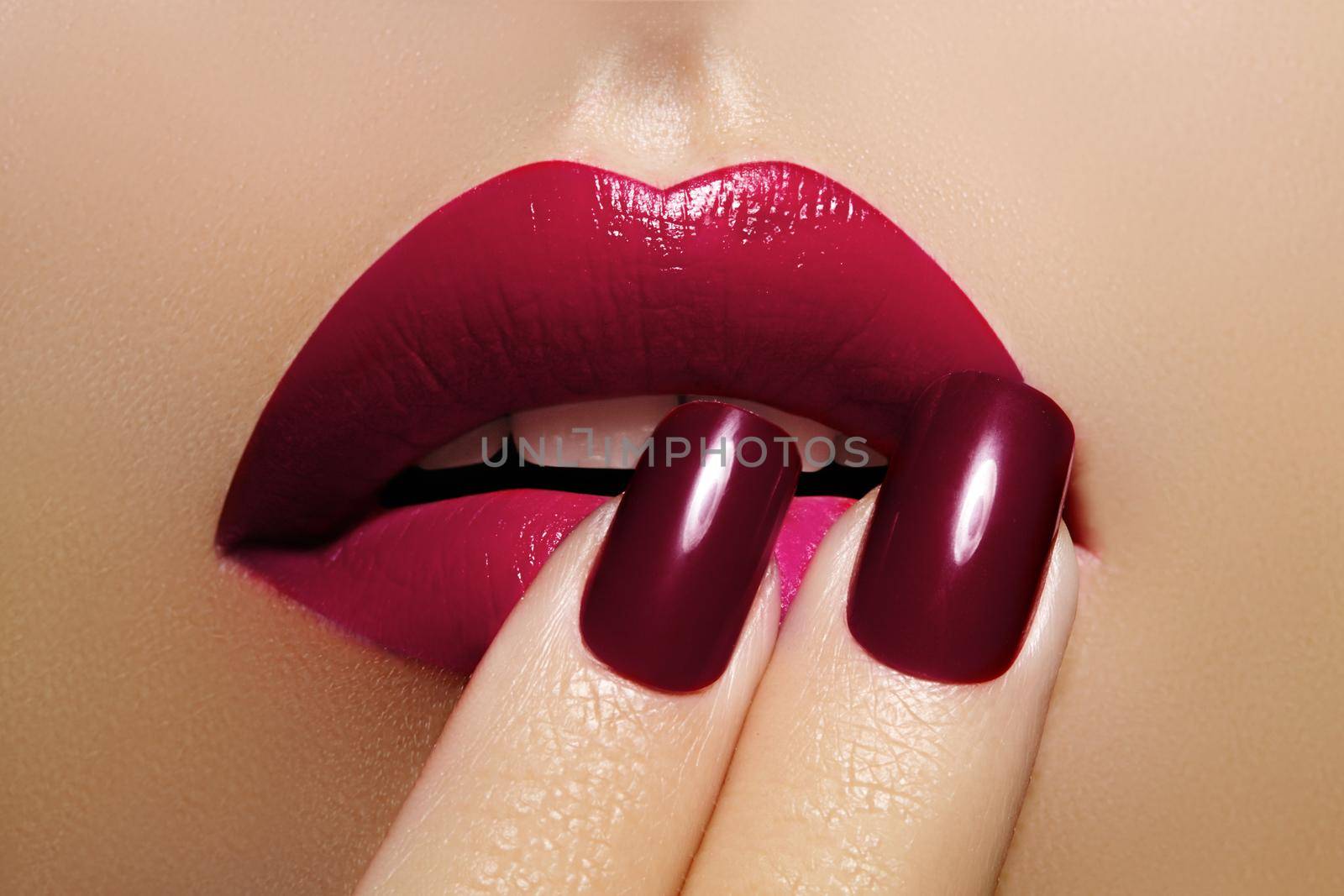 Beautiful Close-up Lips with Fashion Red Makeup. Beauty Lip Visage. Passionate kiss. Bright Cherry Lipstick and Manicure by MarinaFrost