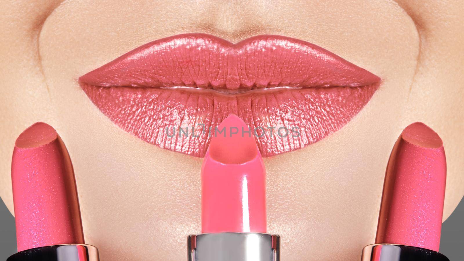 Choose your Color Lipstick. Macro shot photo lips with fashion pink make-up. Beautiful makeup on lips. Choice lipstick by MarinaFrost