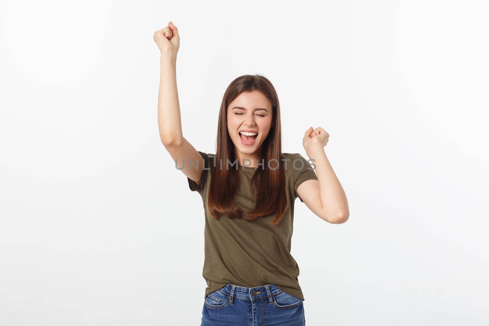 Winning success woman happy ecstatic celebrating being a winner. Dynamic energetic image of Caucasian female model isolated on white background.