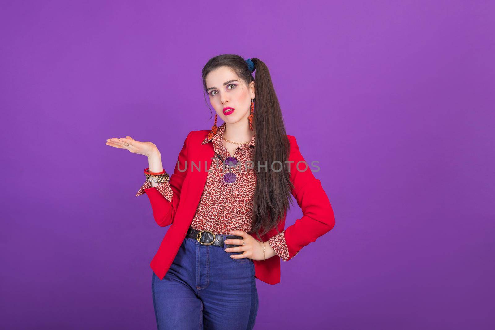 Retro fashion 90s 80s young woman in red jacket portrait, palm up gesture with copy space.