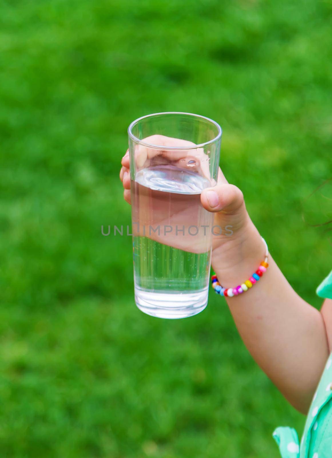 children drink clean water in nature.selective focus.nature