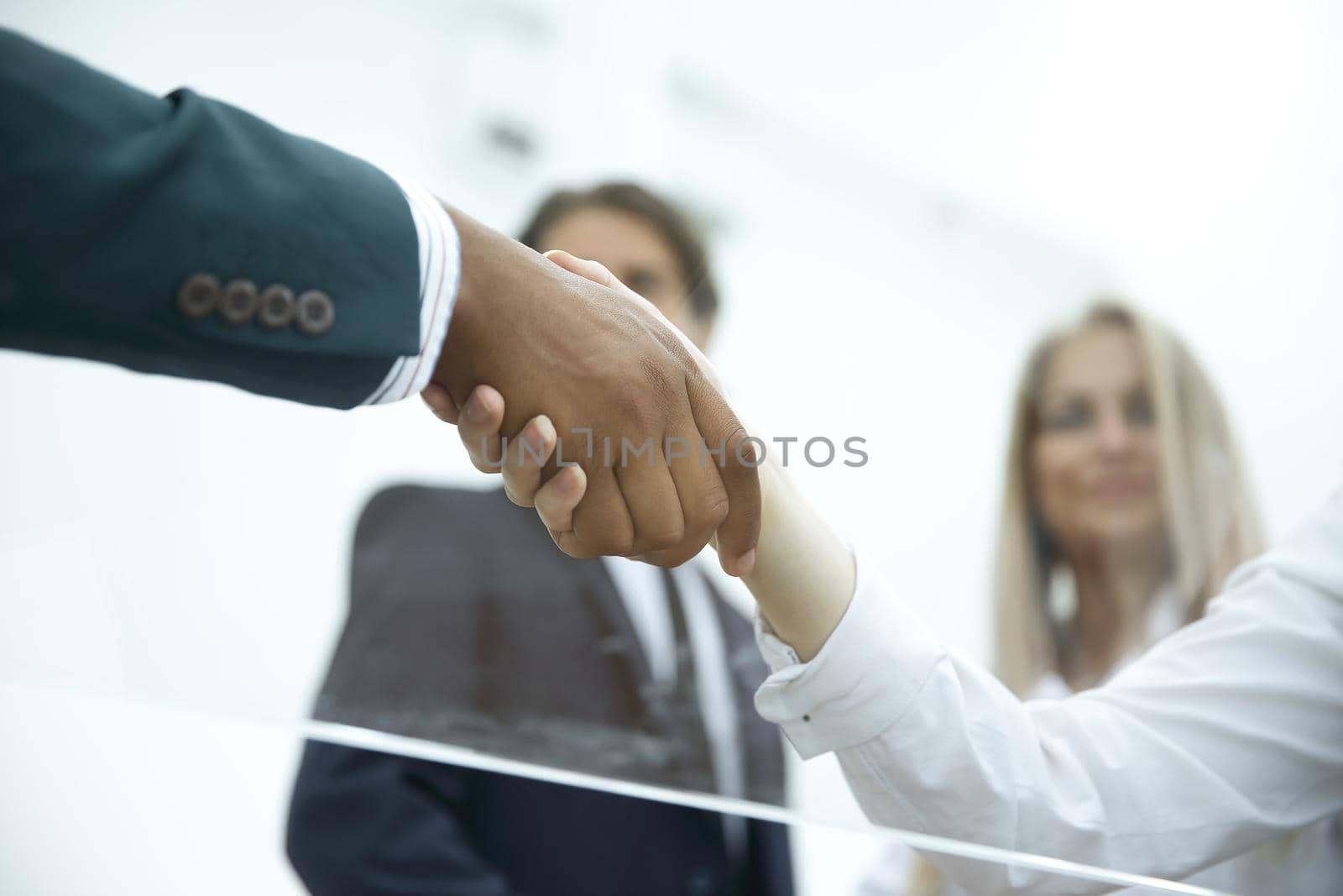 bottom view .handshake business women with a business partner.closeup