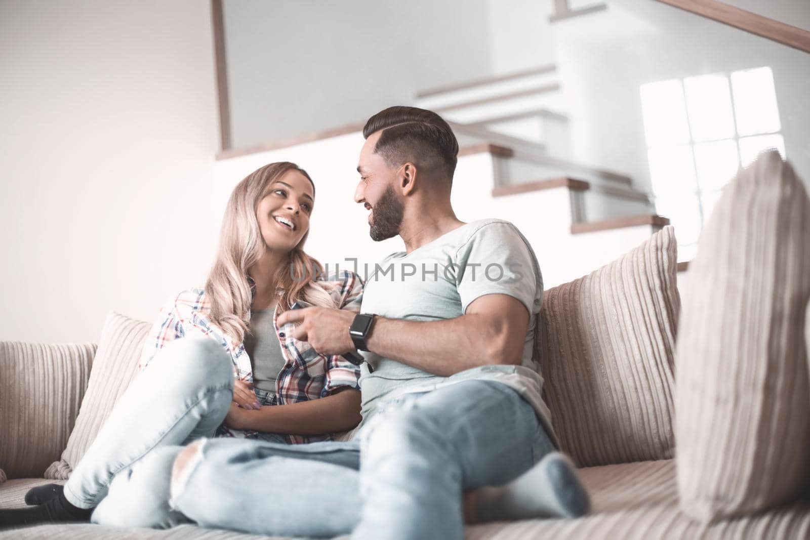 close up. loving couple sitting on sofa in cozy living room