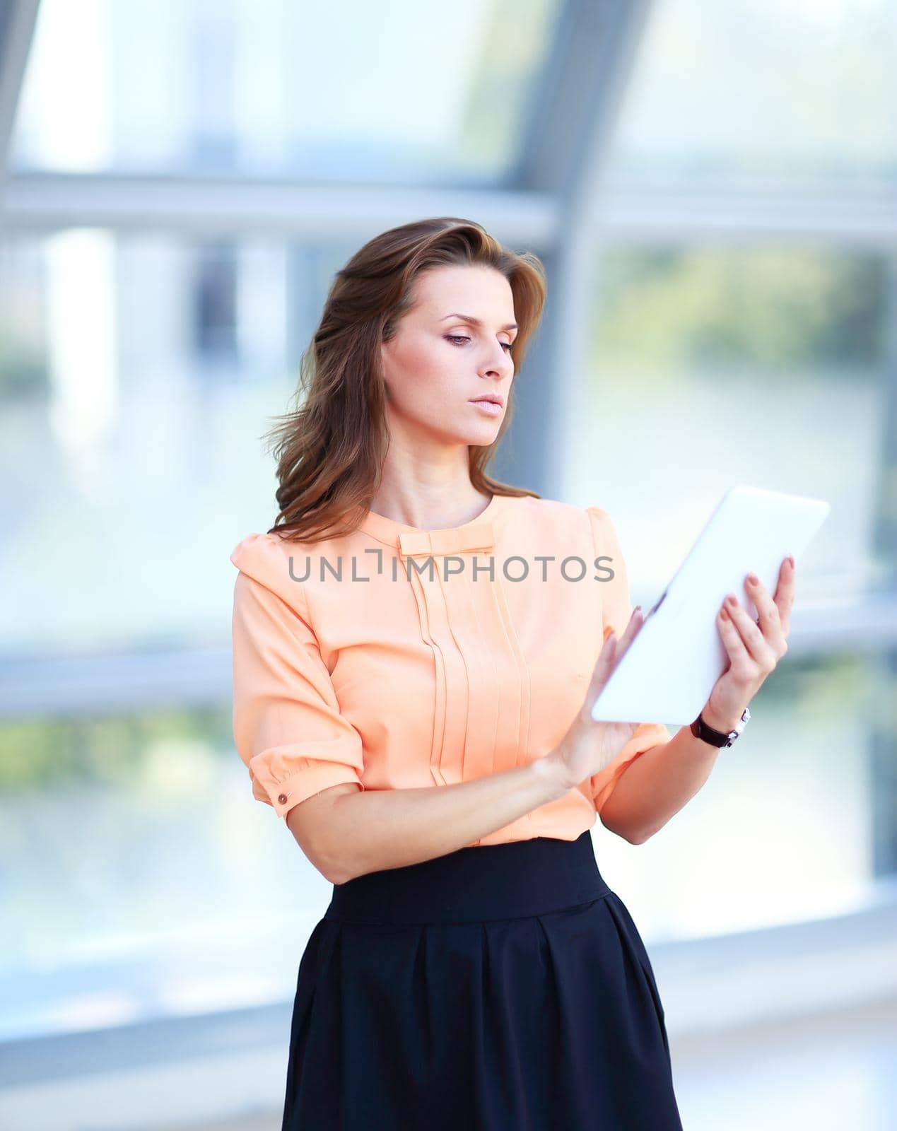 young business woman with digital tablet in office lobby.people and technology
