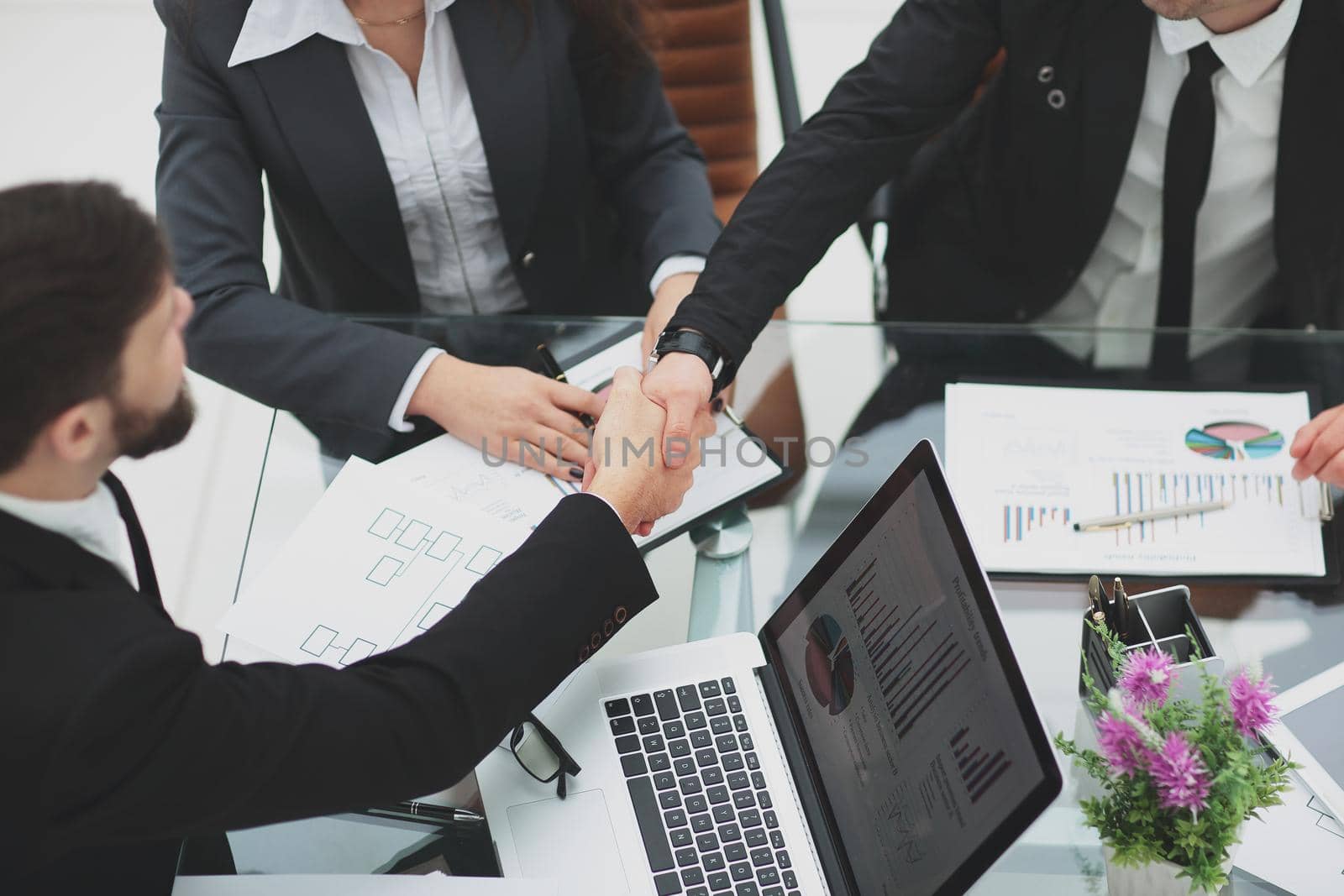 close up. handshake of trading partners at the negotiating table in the office