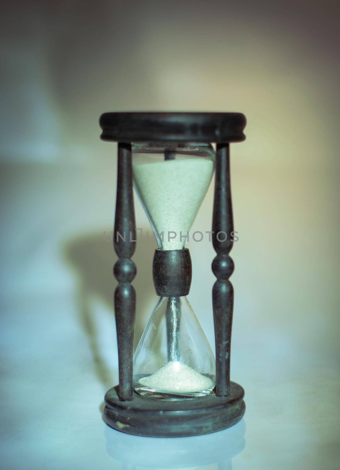 hourglass on dark background.the concept of time.photo with copy space