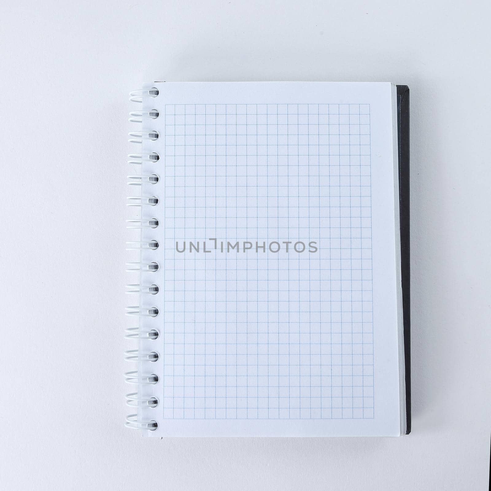 blank sheet of notebook isolated on a white background.photo with copy space.