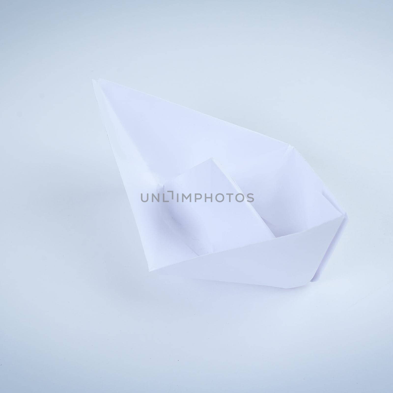 paper boat made in the technique of origami. .photo with copy space