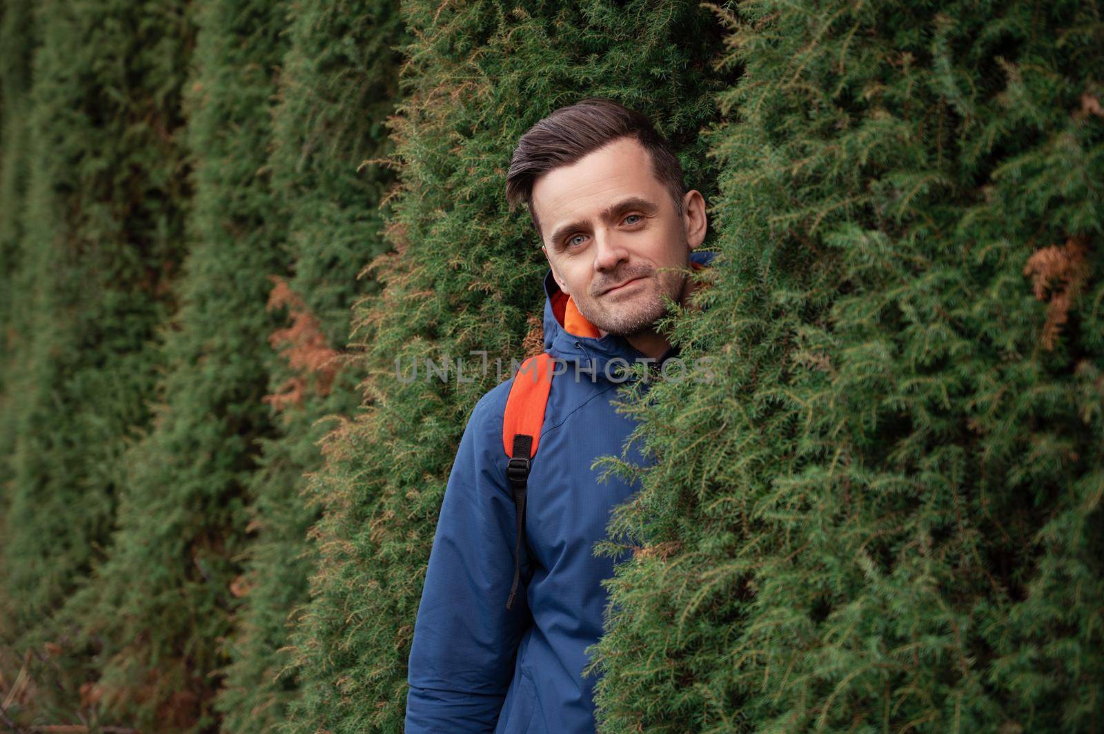 Man portrait in autumn park on fall nature background