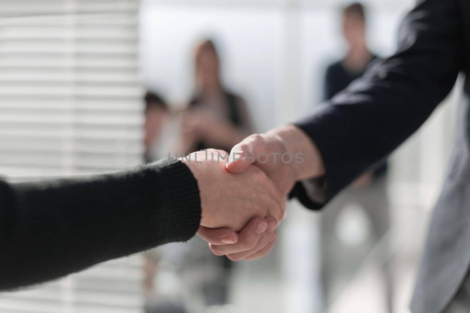 Businessmen making handshake in the city - business etiquette, c by asdf