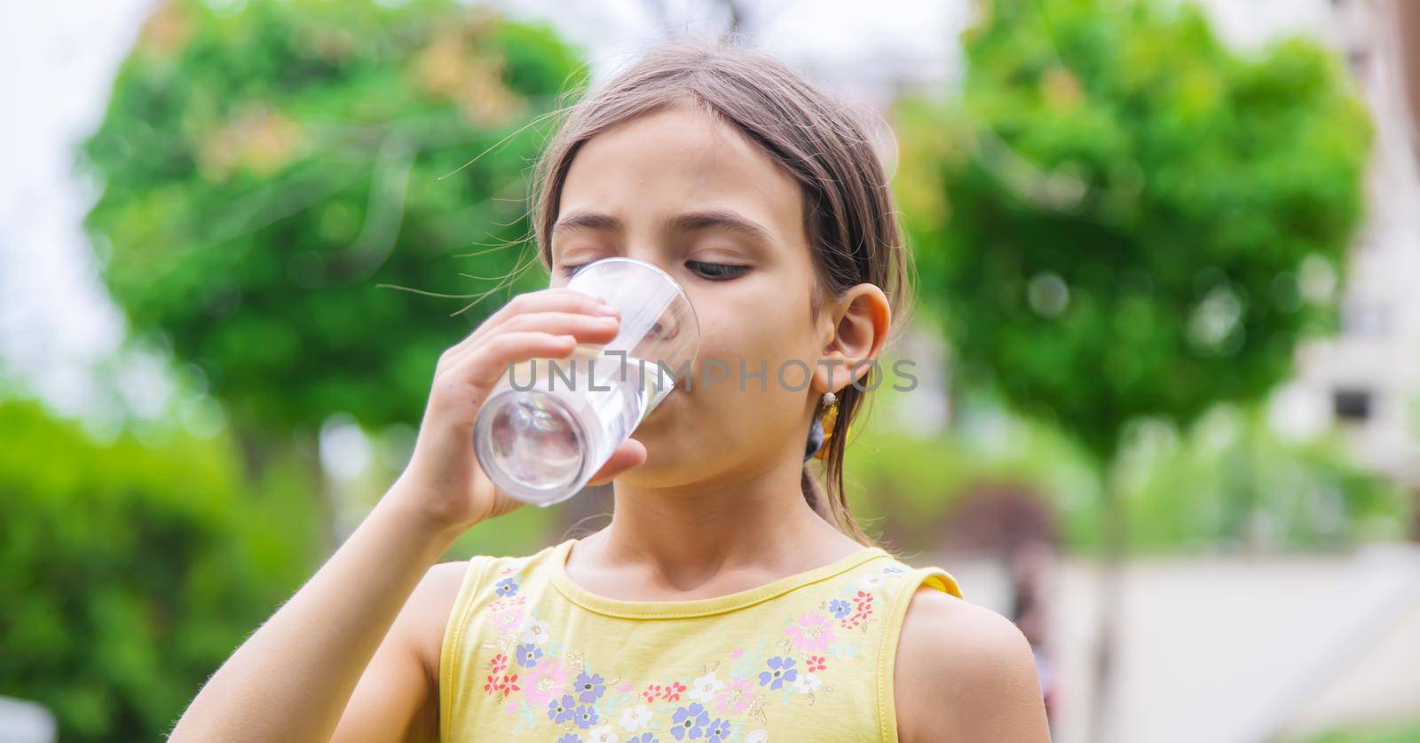 children drink clean water in nature.selective focus.nature