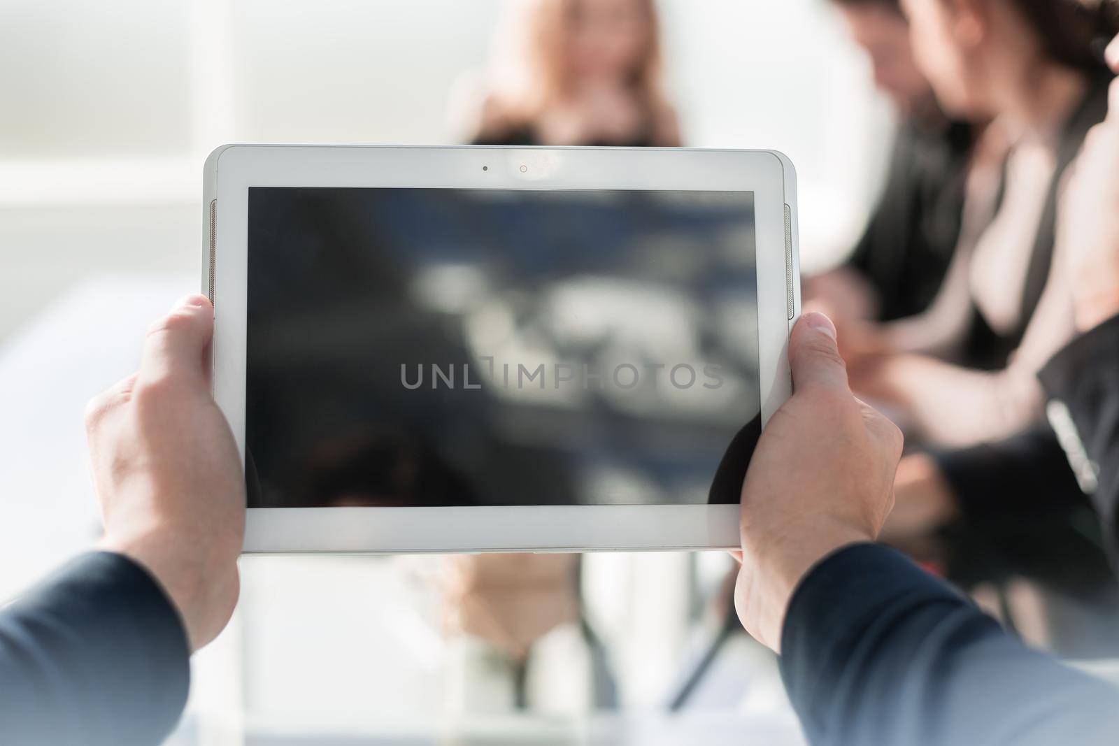 Businessman holding digital tablet