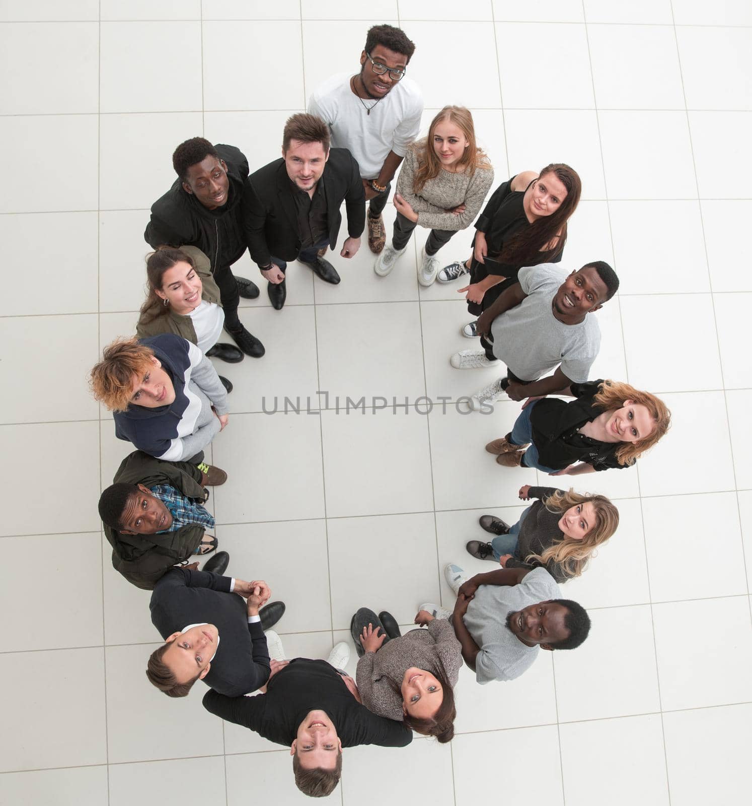 group of young successful people stands around by asdf