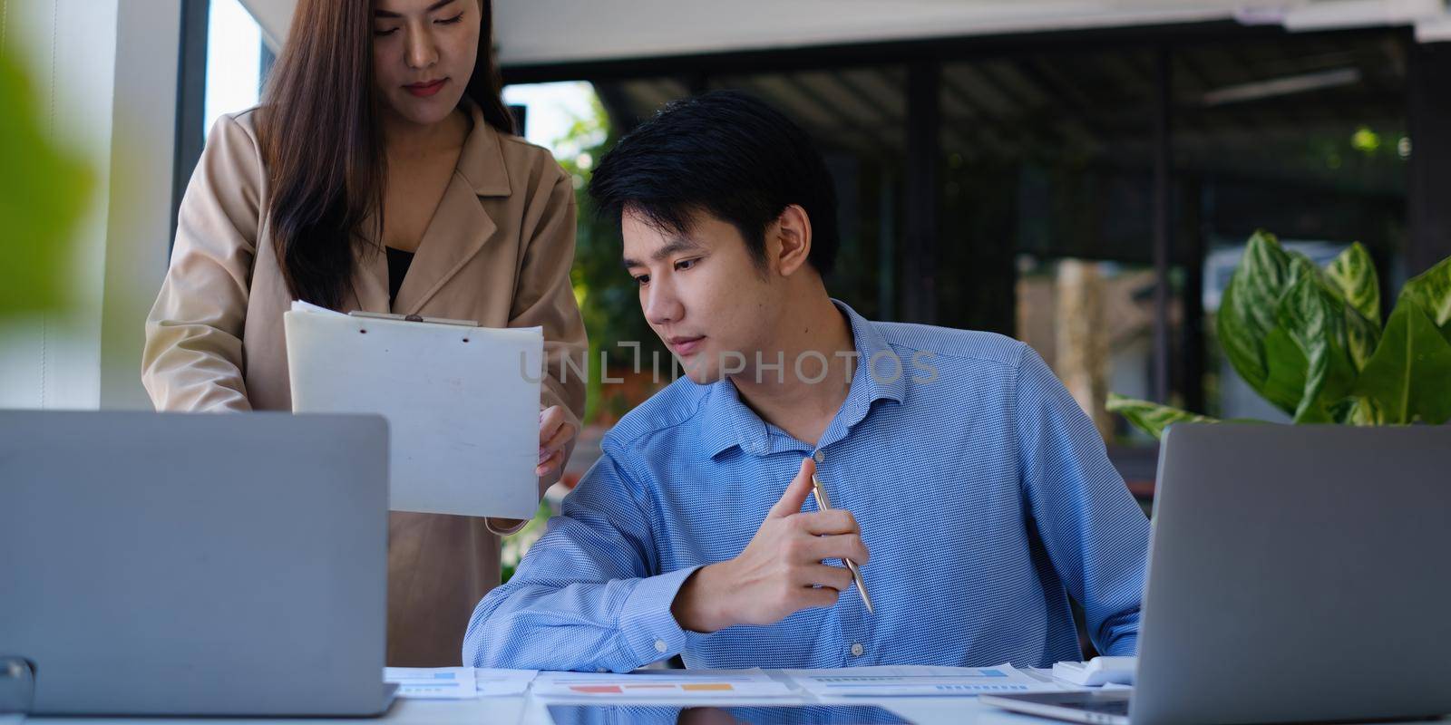 Asian Business people and Accountant checking data document for investigation of corruption account. Anti Bribery concept. by itchaznong