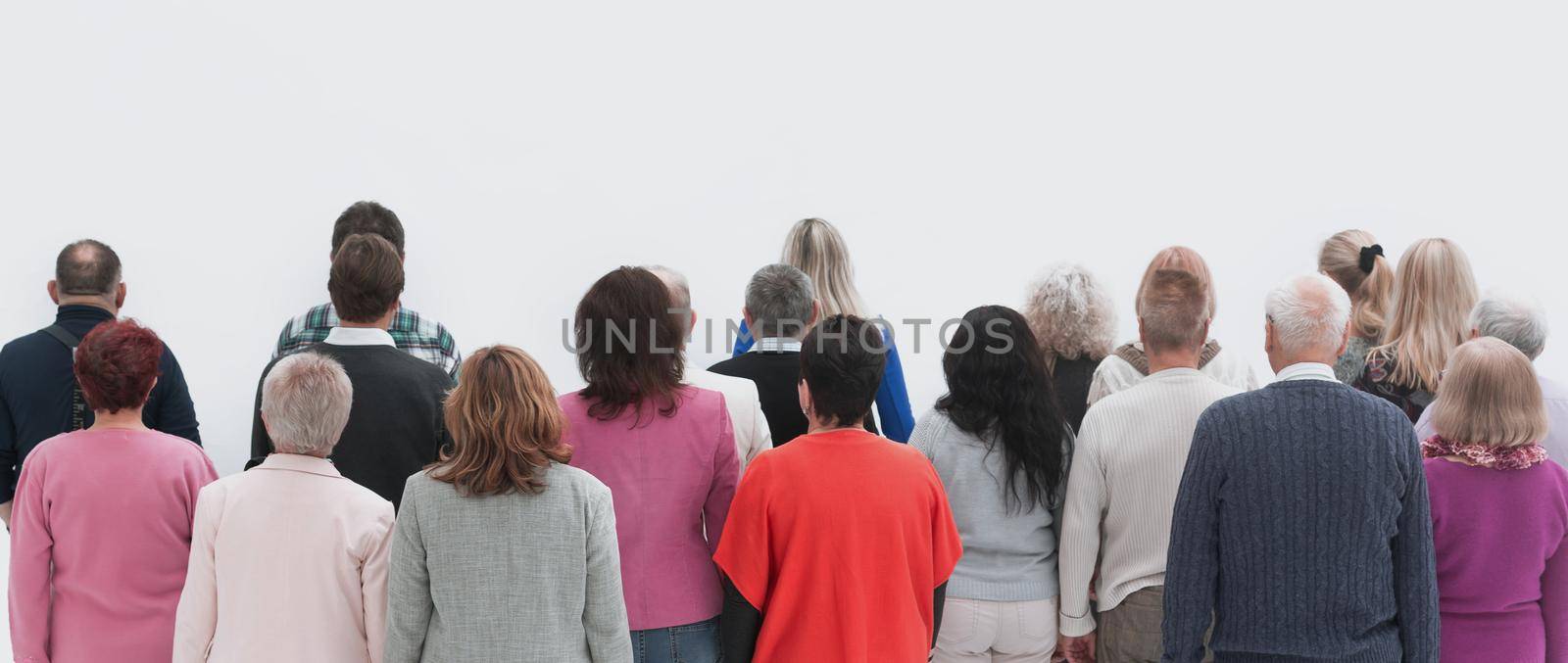 Rear view of a casual group of people looking on blank by asdf