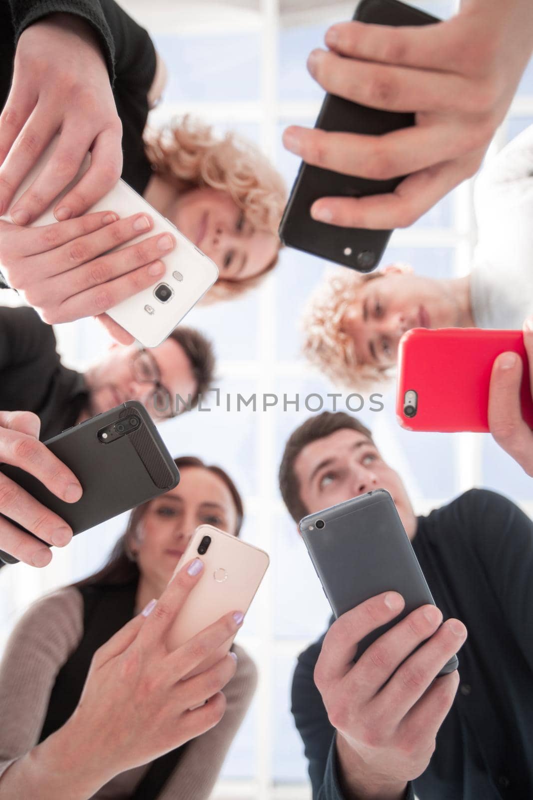 Group of businessman hold smartphones.