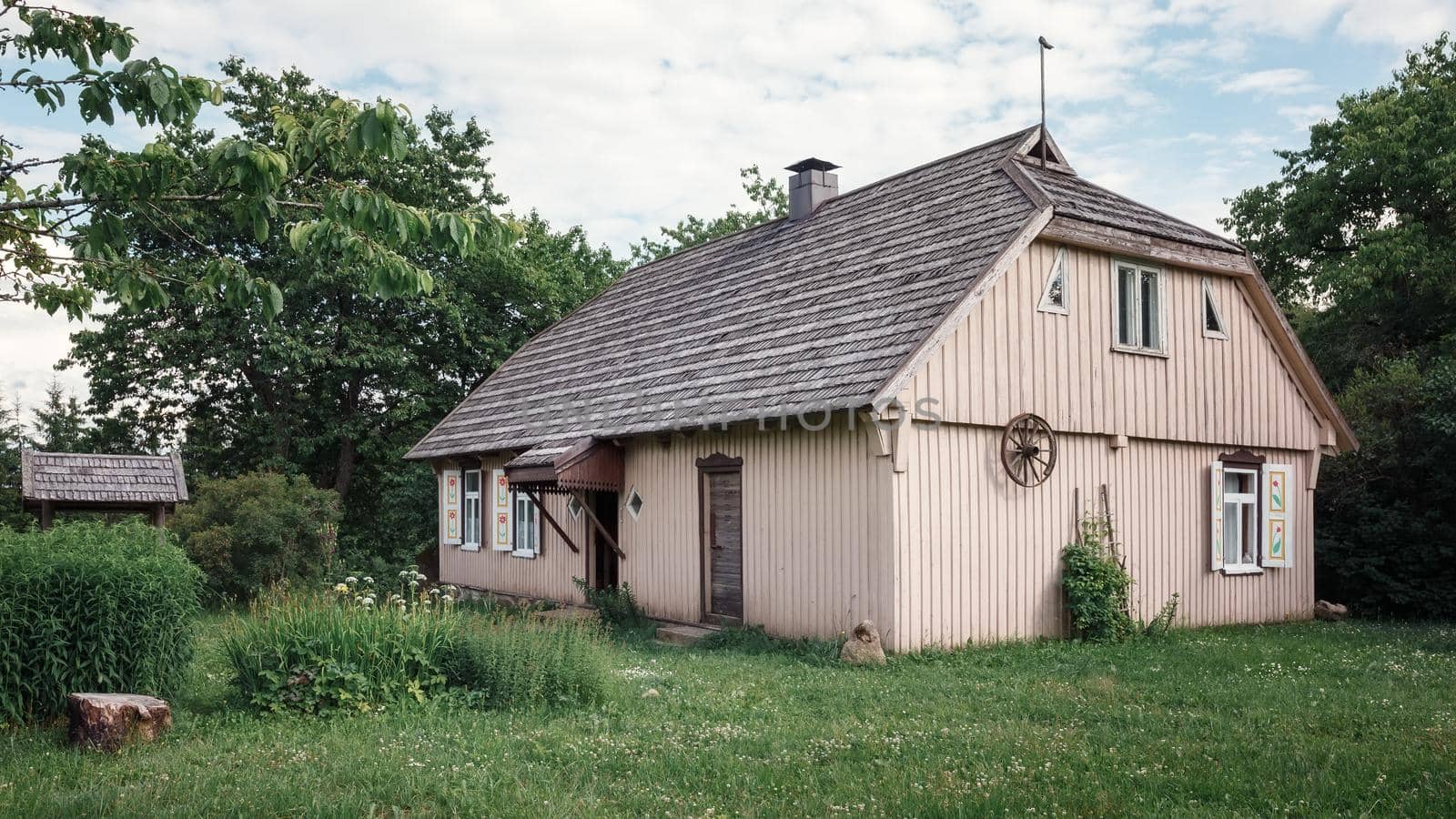 Traditional Lithuanian wooden house in the countryside. Plateliai village, Lithuania.