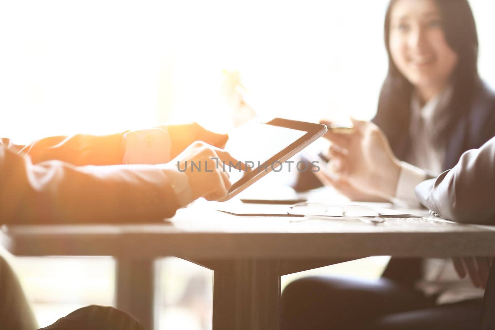 close up.business team sitting at the Desk by SmartPhotoLab