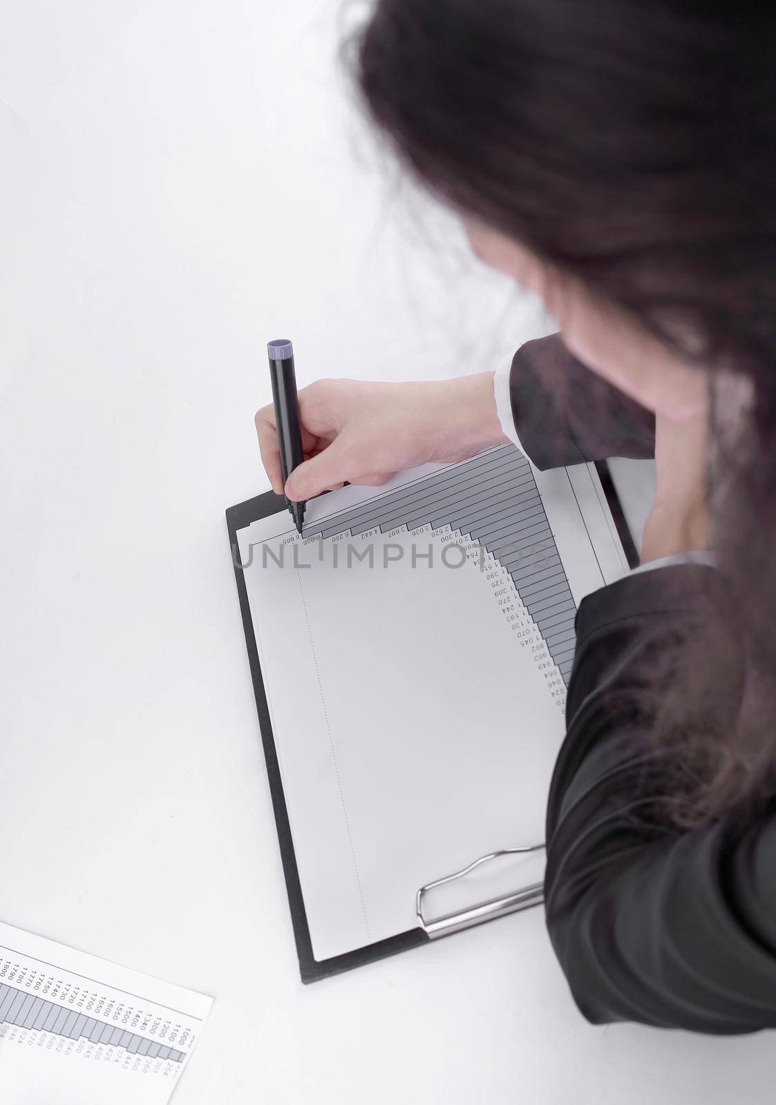 close-up. sales Manager checking the financial schedule.isolated on white background