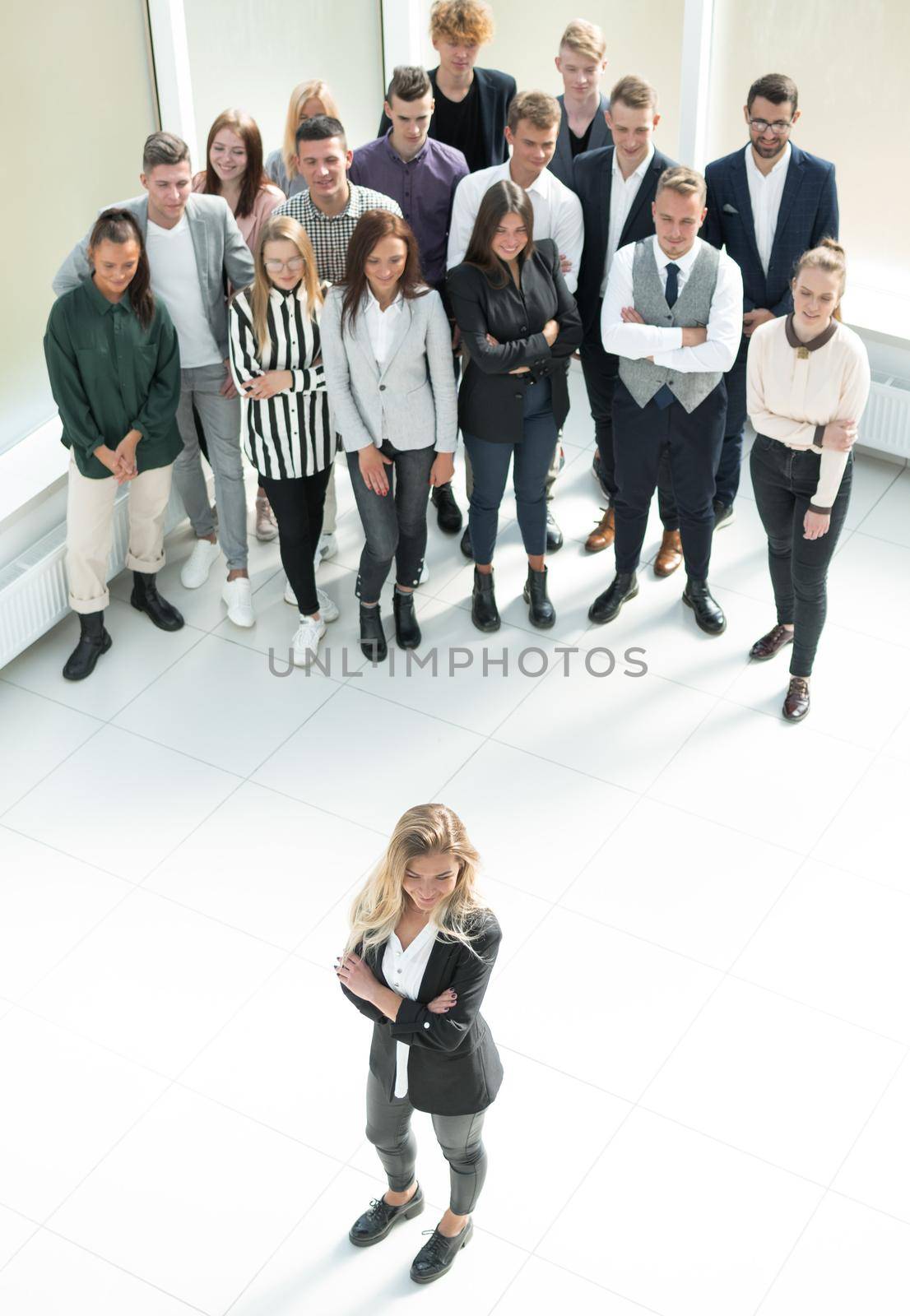 top view. female leader standing at the front of the business team by asdf