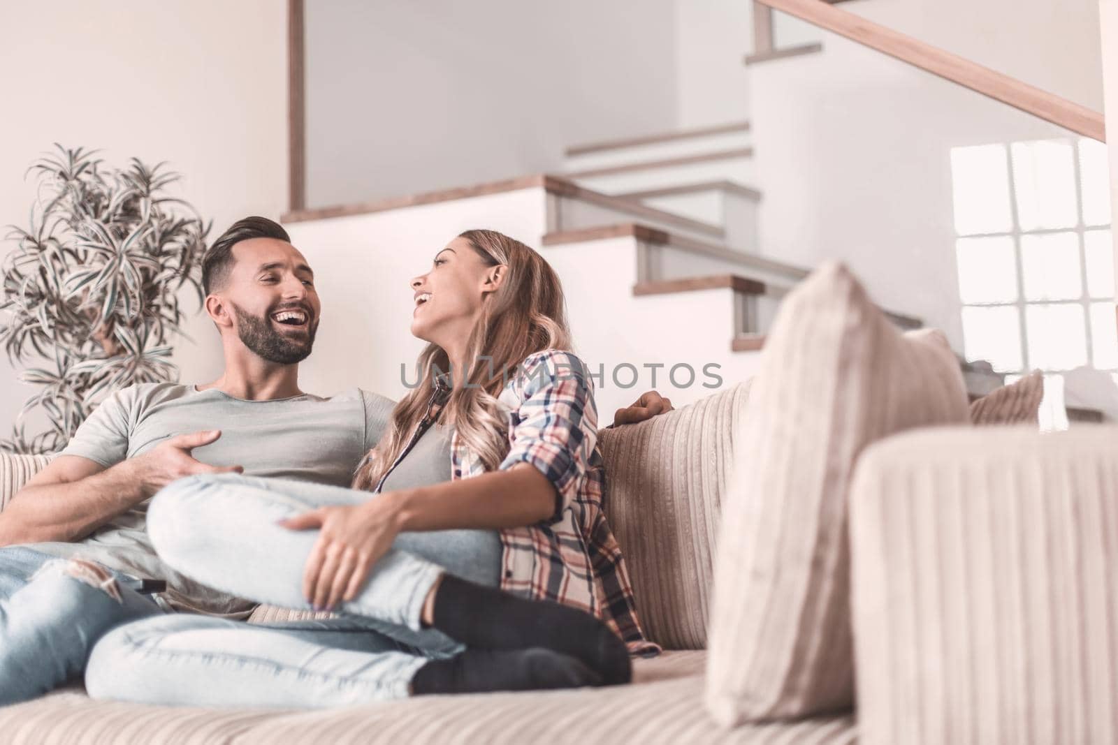 loving couple relaxing on the couch on a free evening by asdf