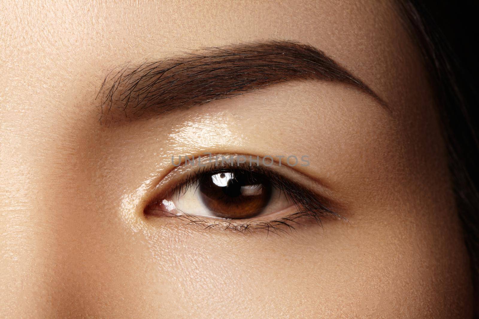 Beautiful female eye with clean skin, daily fashion makeup. Asian model face. Perfect shape of eyebrow by MarinaFrost