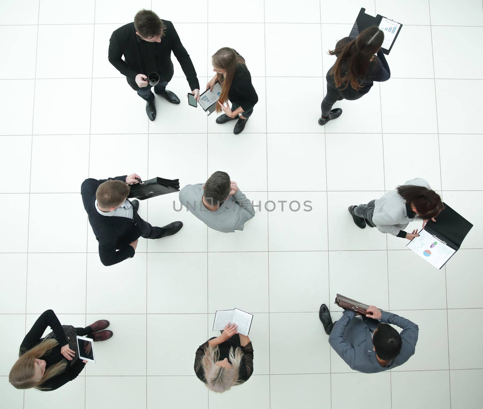 top view. group of diverse business people with financial documents by asdf