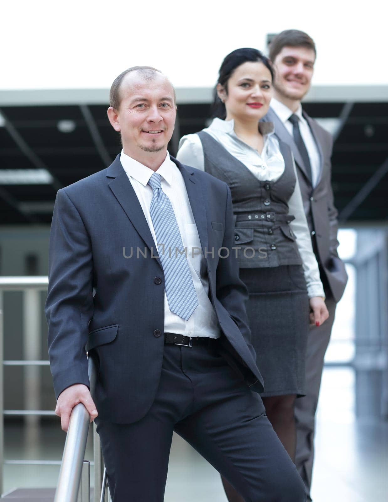 group of business people on the background of the office by SmartPhotoLab
