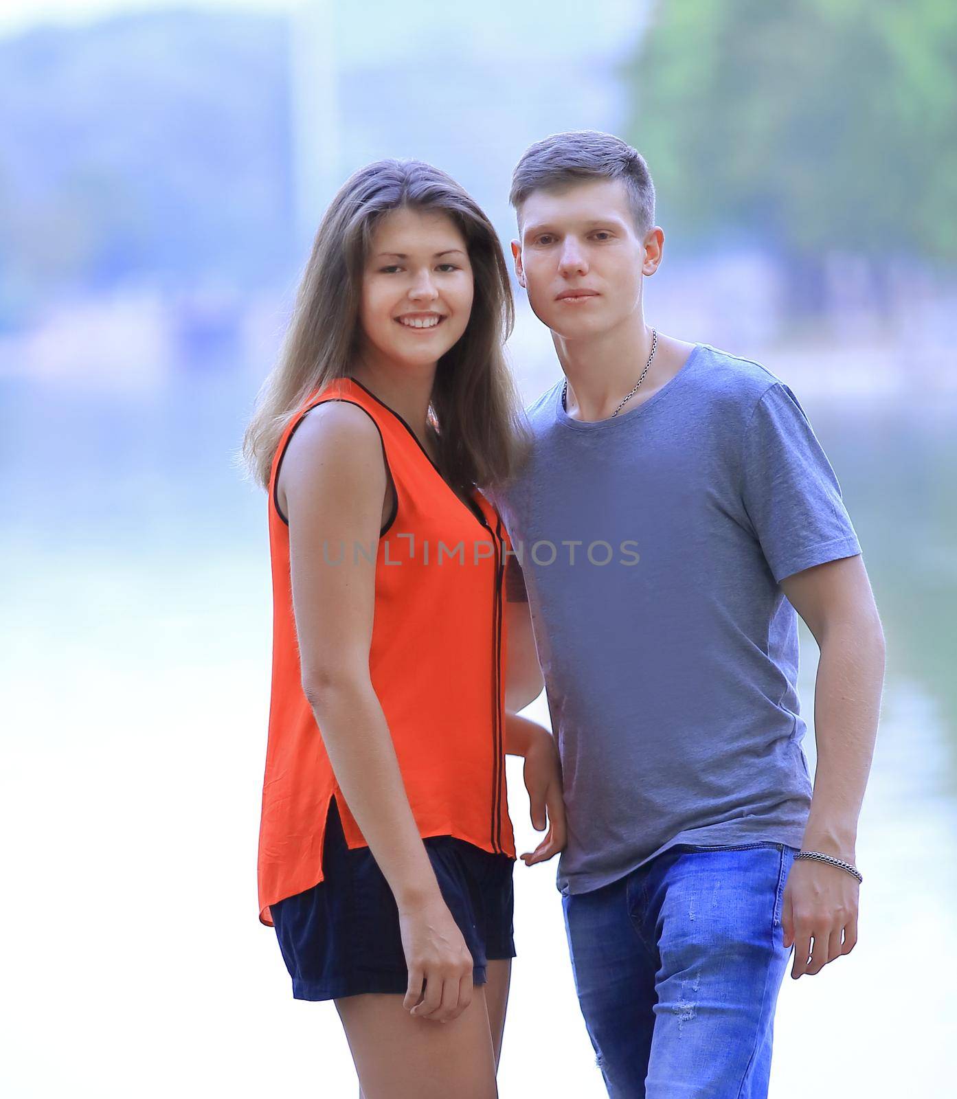 student pairs on blurred background of lake city by SmartPhotoLab