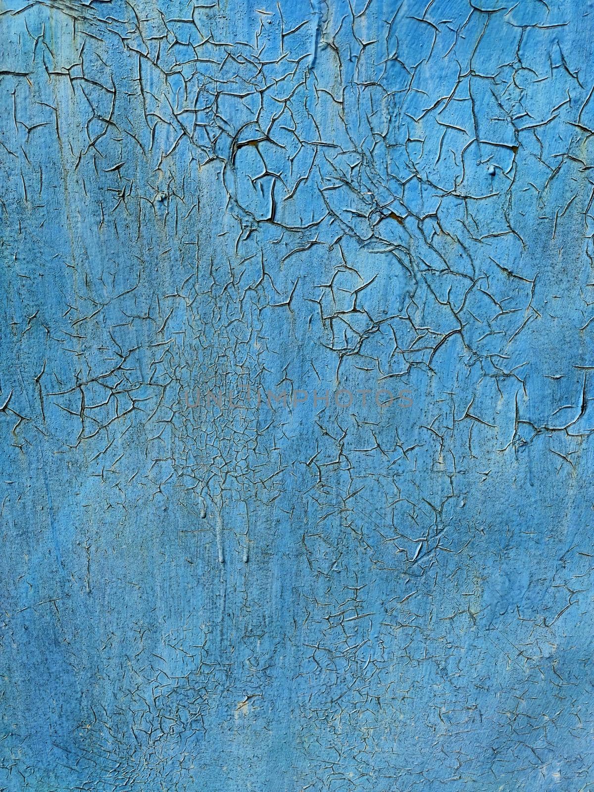 Corroded metal background. Rusted blue painted metal wall. Rusty metal background with streaks of rust. Rust stains. The metal surface rusted spots. Rystycorrosion.