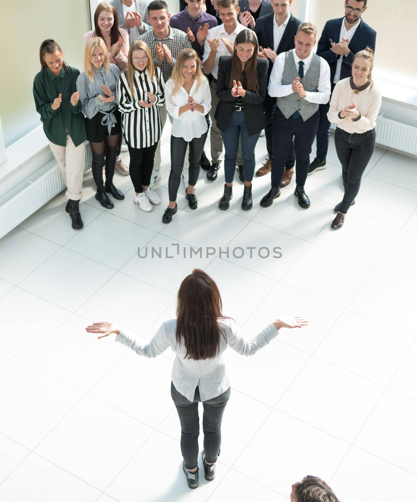 top view. female leader standing at the front of the business team . business concept