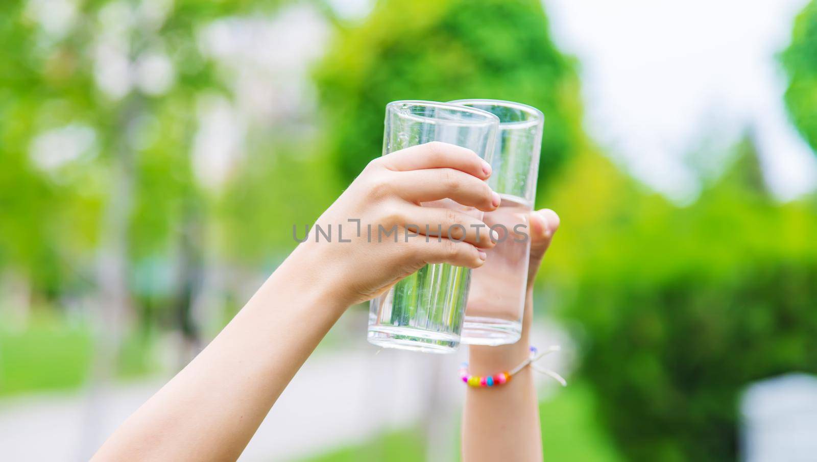 children drink clean water in nature.selective focus.nature