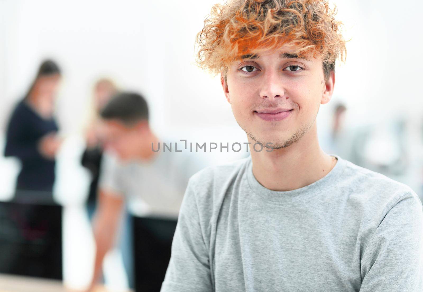 close up. portrait of a successful young man on an office background.