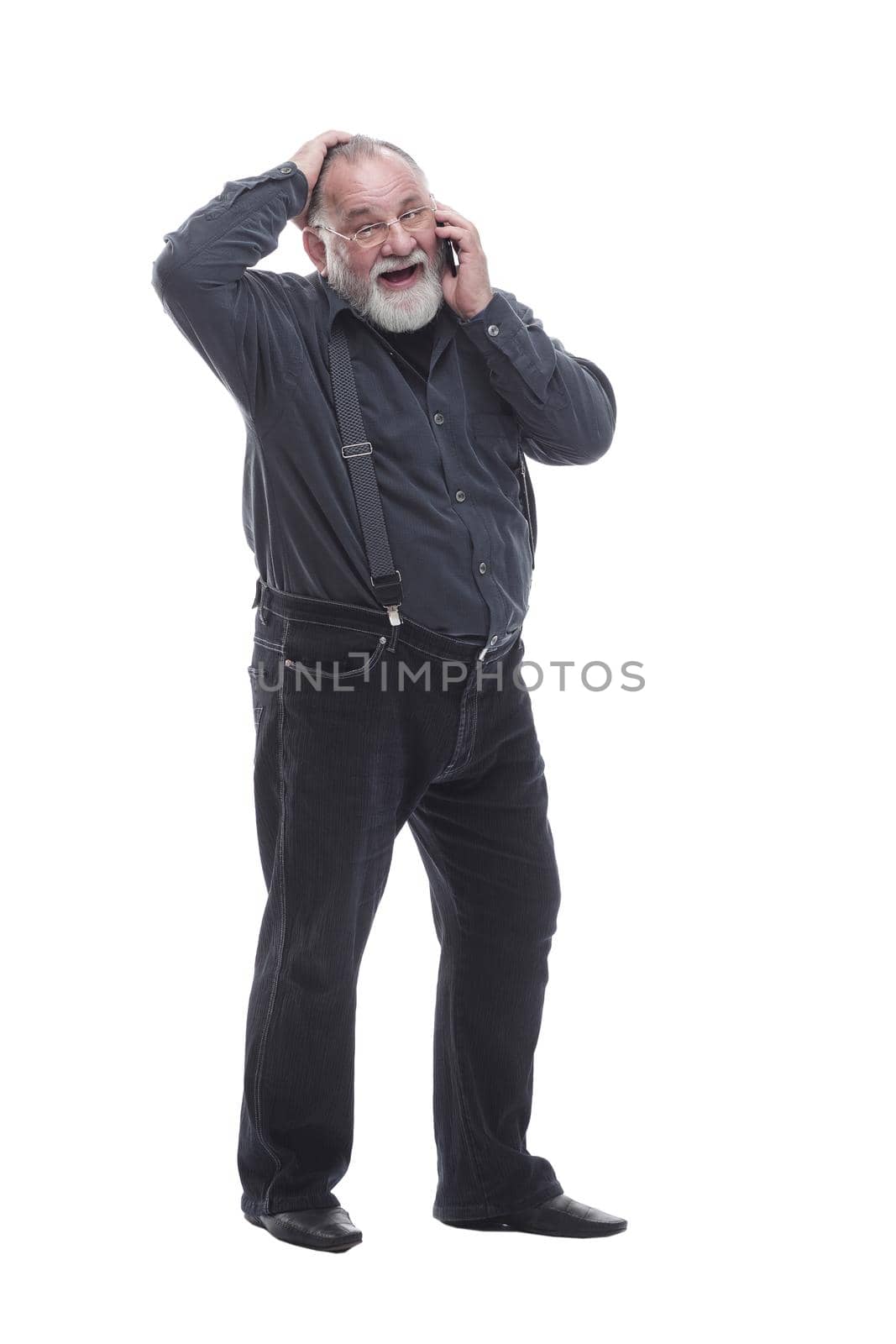 in full growth. friendly elderly man with a smartphone. isolated on a white