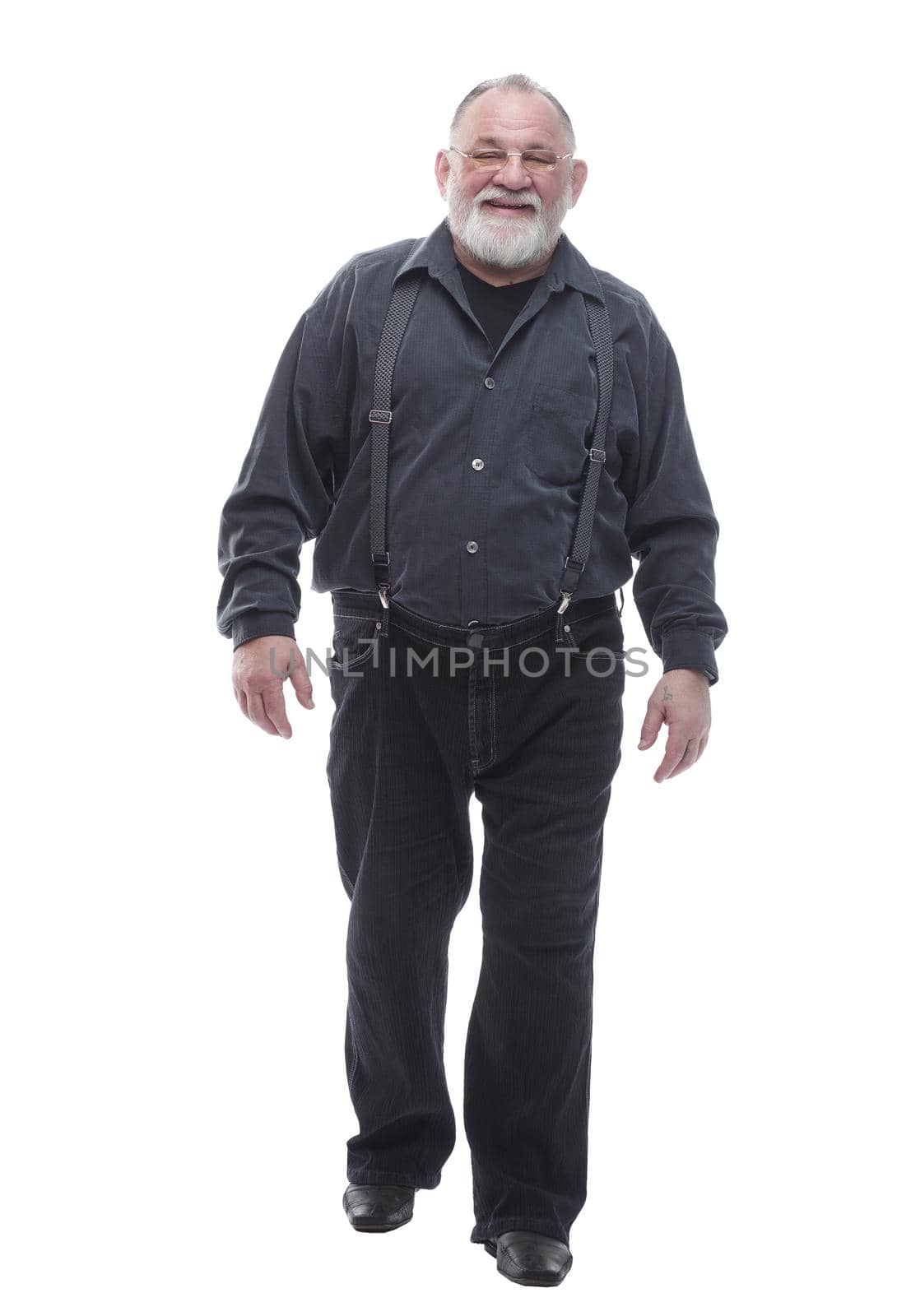 in full growth. smiling bearded man striding forward. isolated on a white