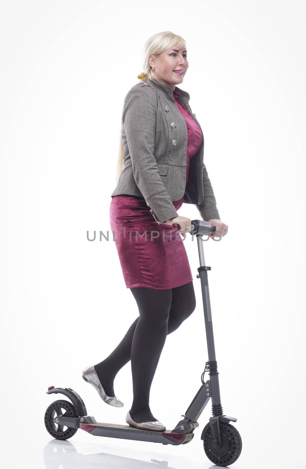 attractive happy woman with an electric scooter. isolated on a white by asdf