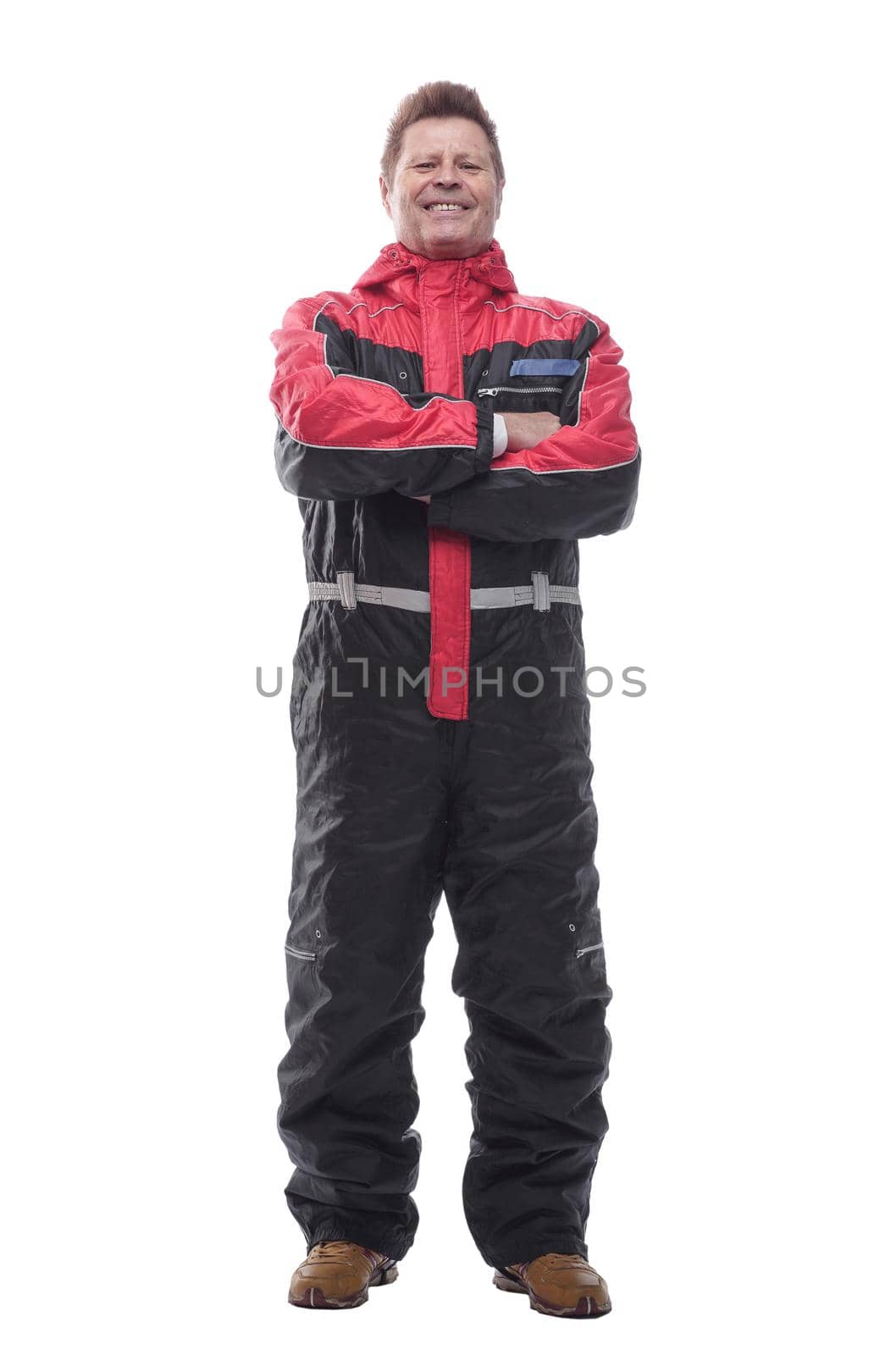 in full growth. happy man in winter insulated overalls. isolated on a white background