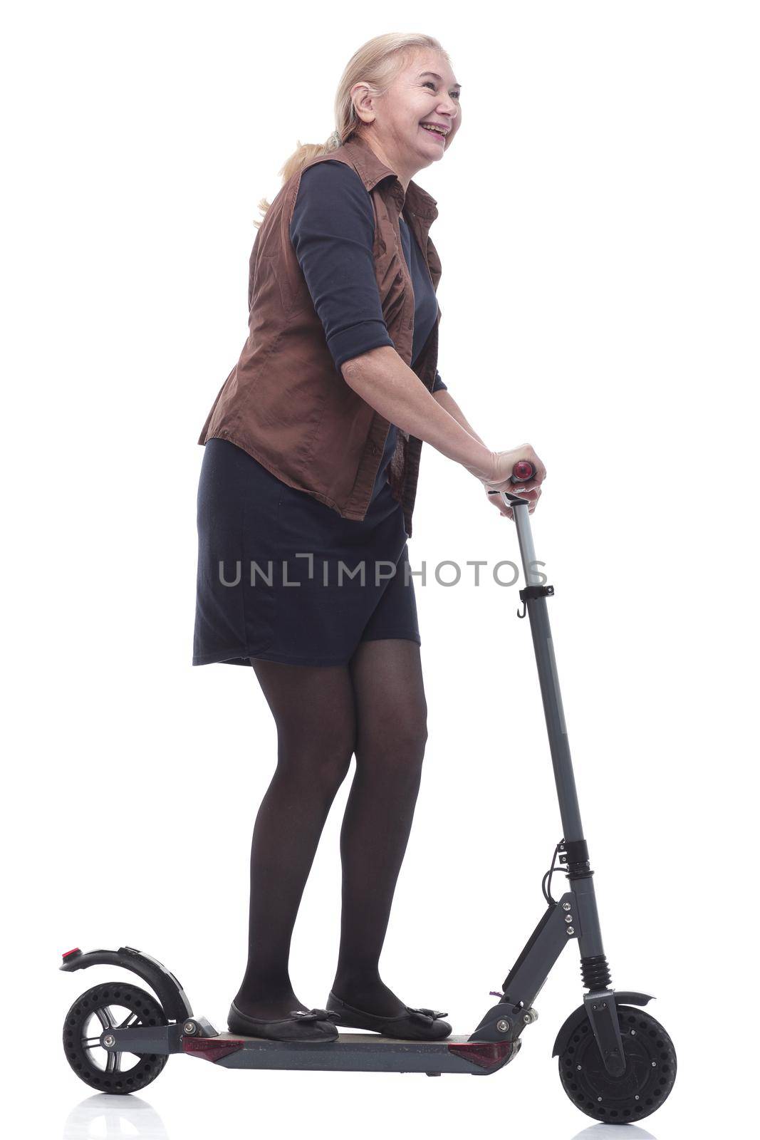 in full growth. happy woman with a comfortable electric scooter. isolated on a white background