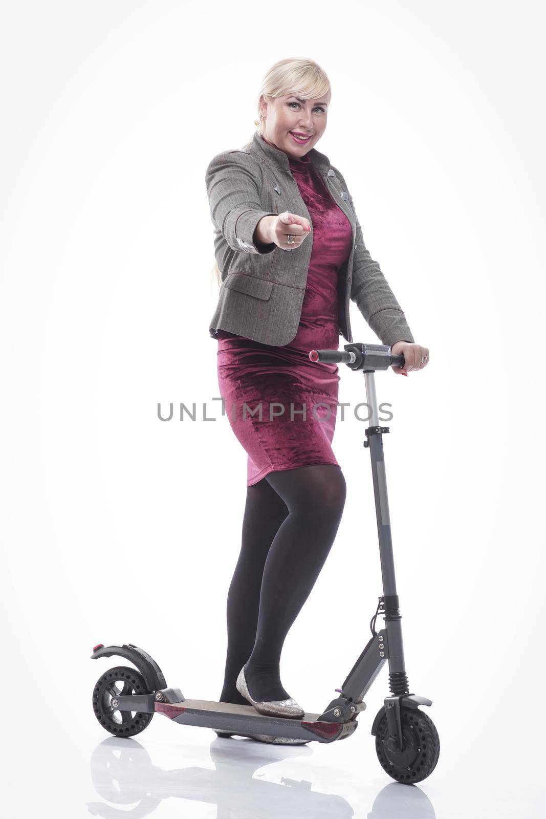 attractive happy woman with an electric scooter. isolated on a white by asdf