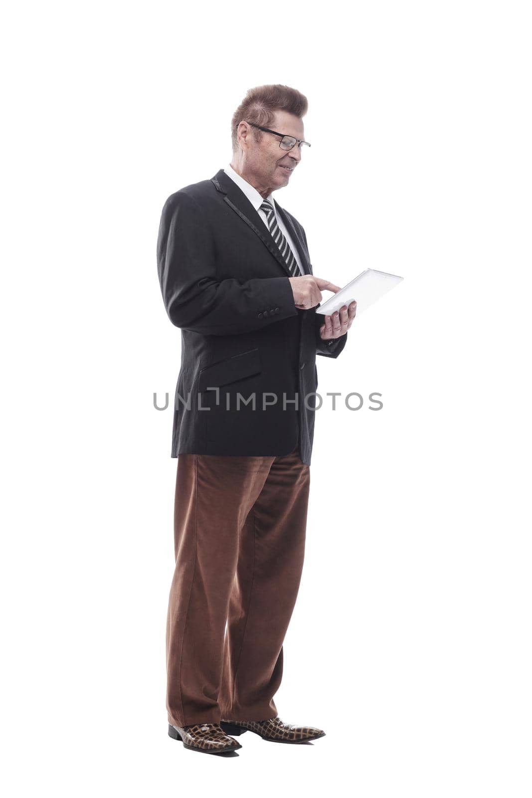 in full growth. happy business man with a digital tablet . isolated on a white background