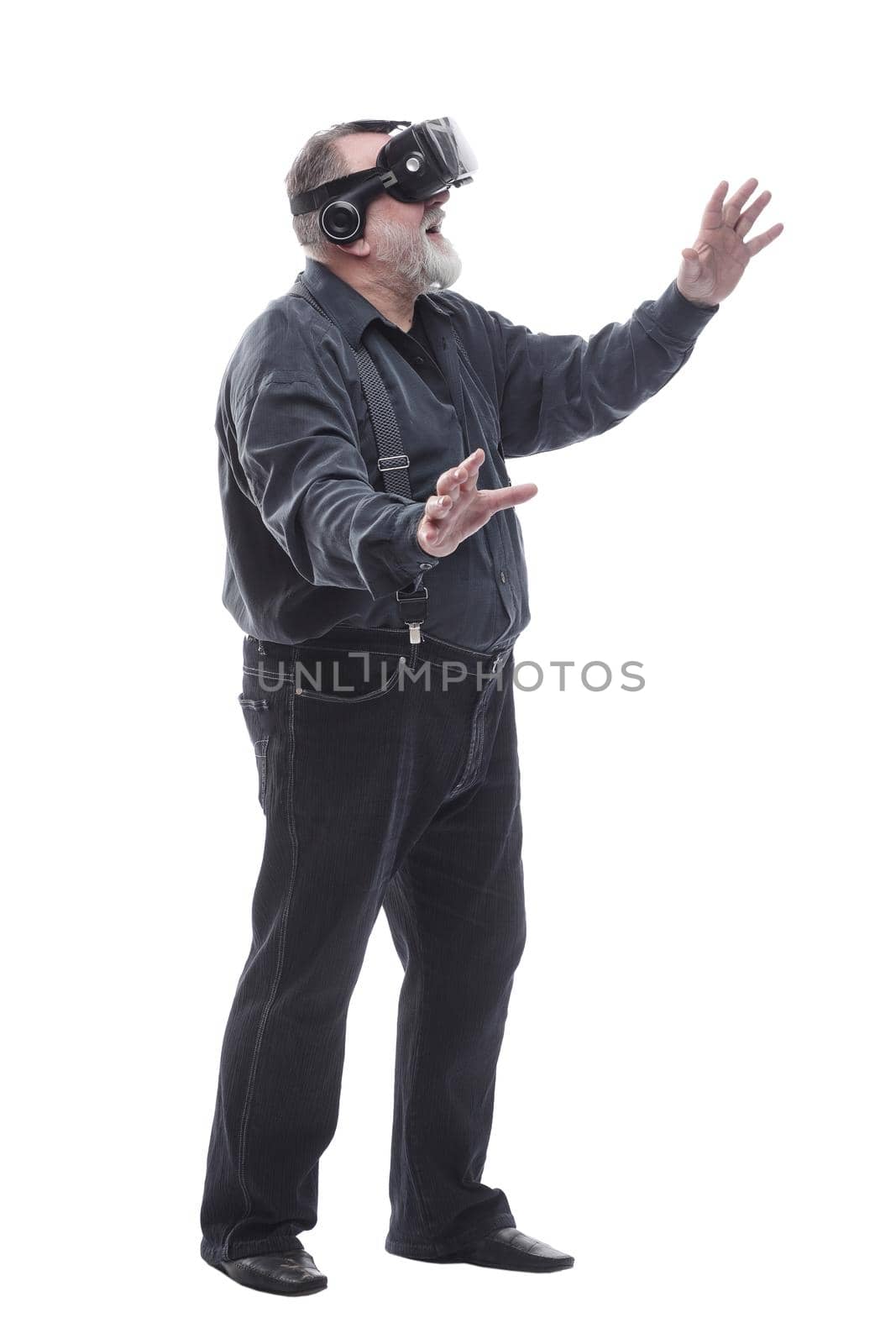 full- length . modern adult male in a virtual reality helmet. isolated on a white background