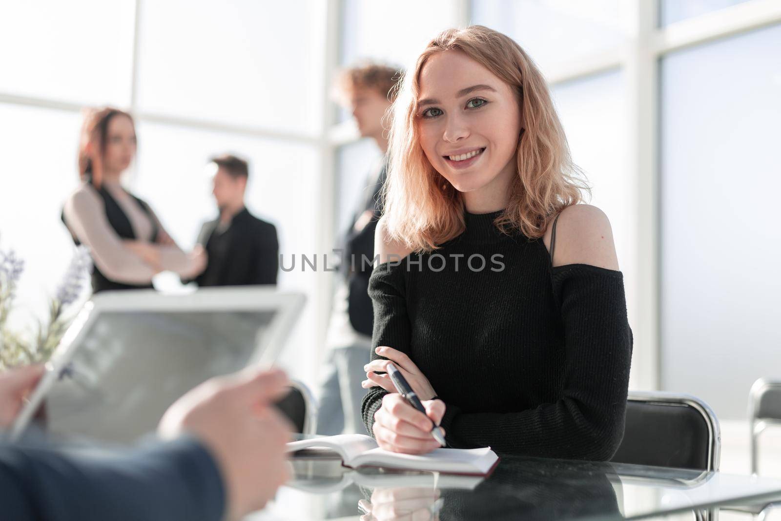 Happy female millennial job applicant sign contract after successful negotiation with confident