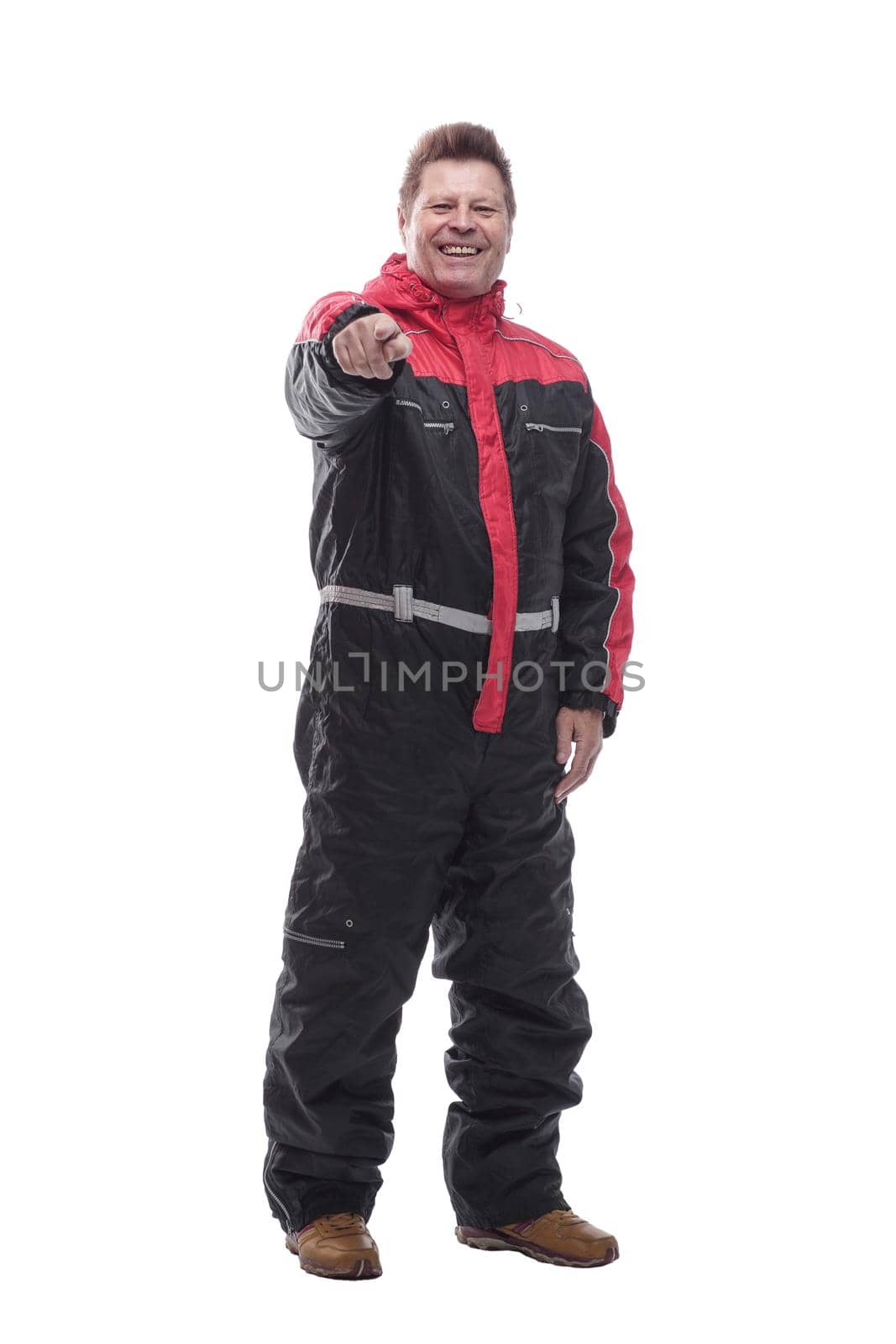 in full growth. happy man in winter insulated overalls. isolated on a white background