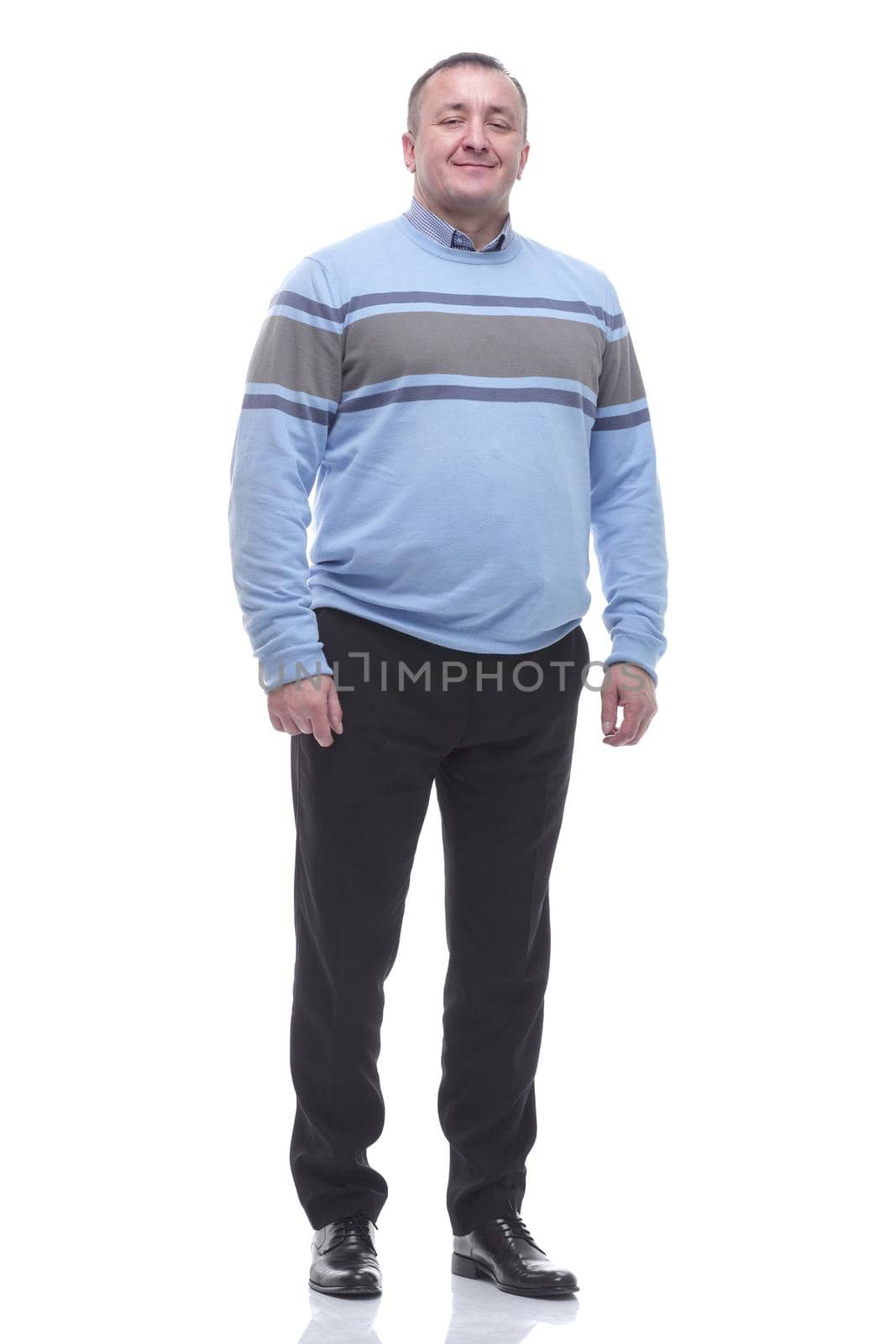 in full growth. smiling mature man in casual clothes. by asdf