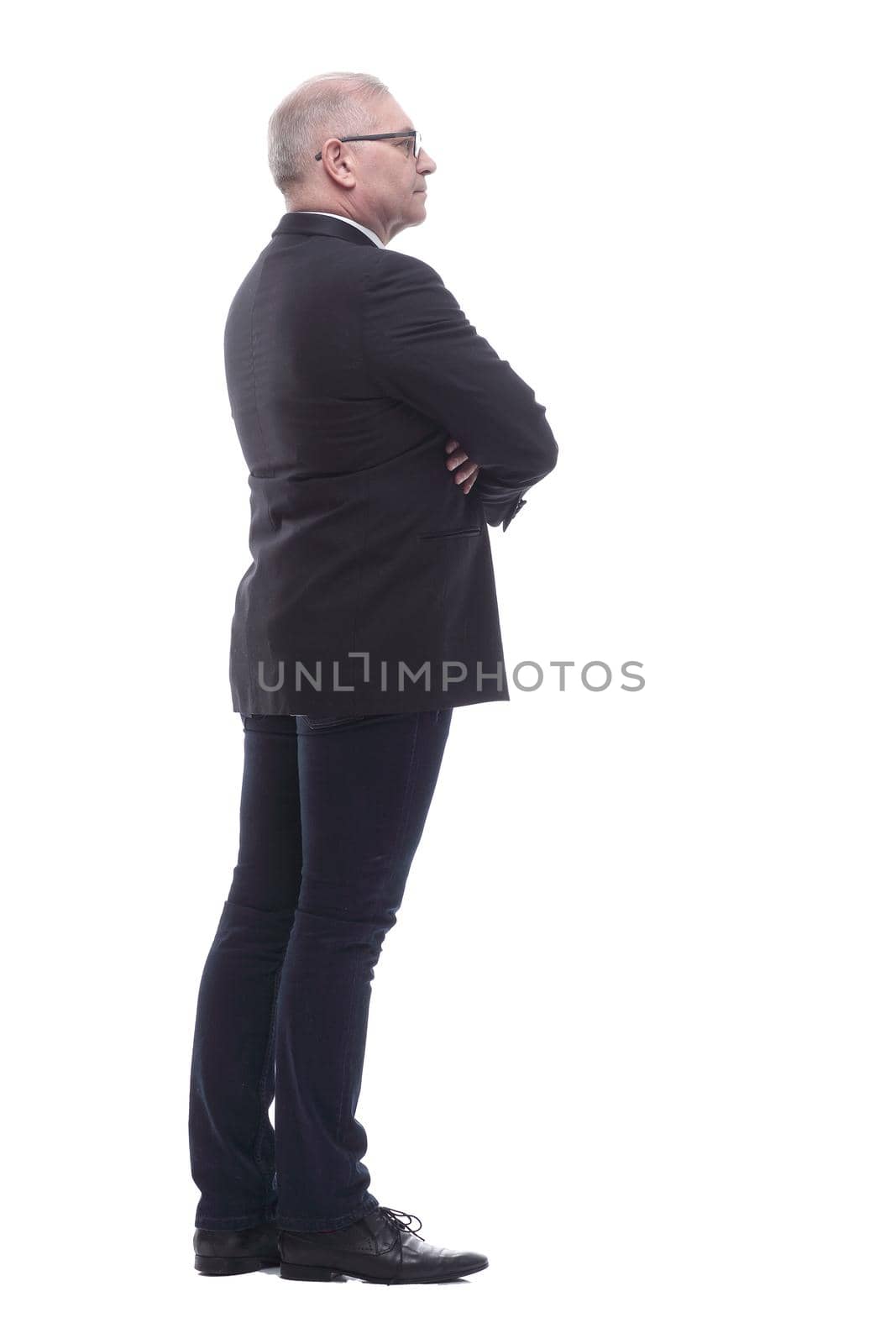 side view. serious business man looking ahead. isolated on a white background