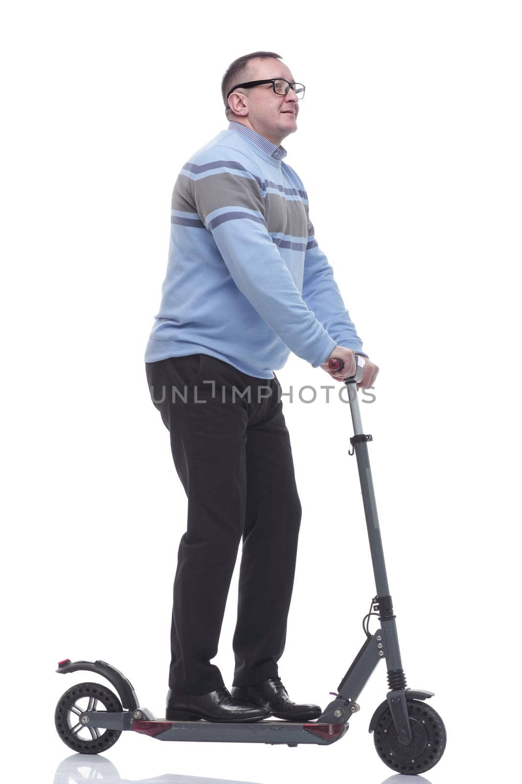 side view. successful modern man with electric scooter. isolated on a white background
